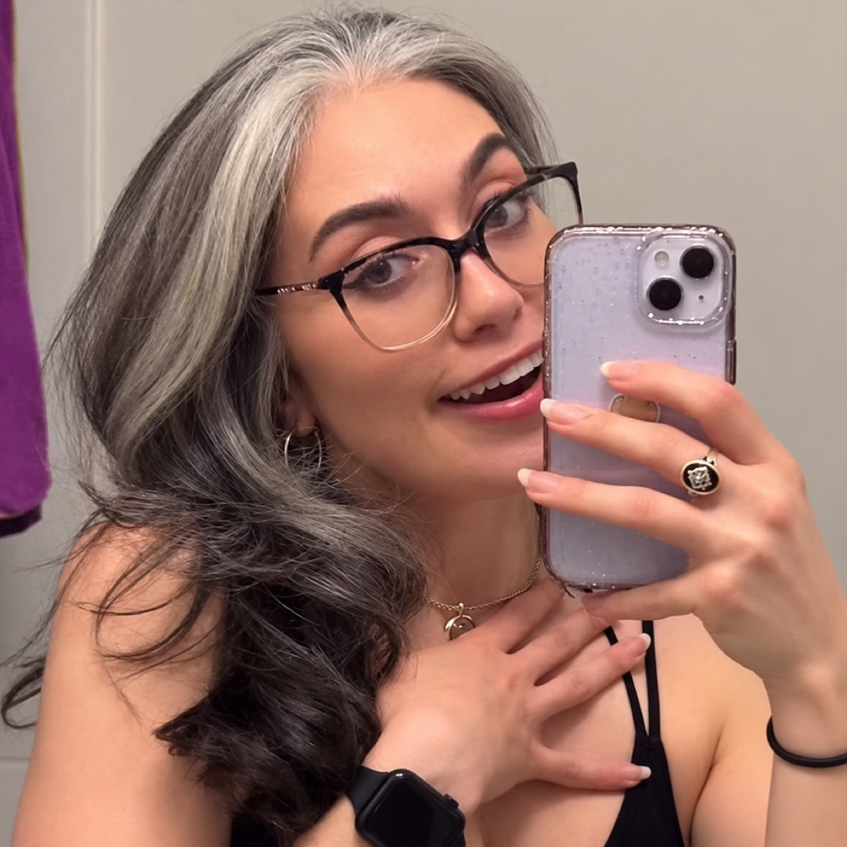 Woman with grey roots and dark hair before temporary colour