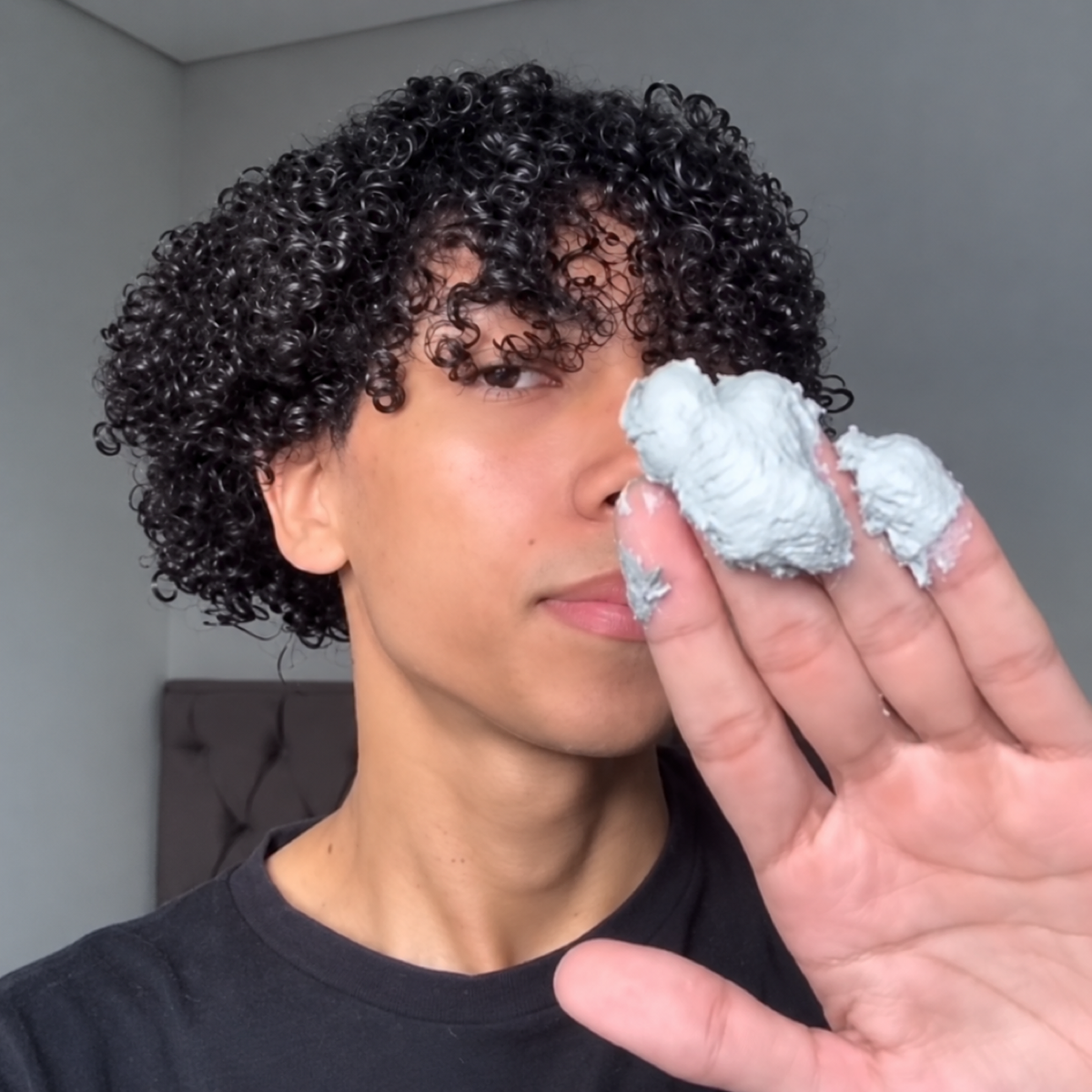 Black curls before applying temporary hair colour wax